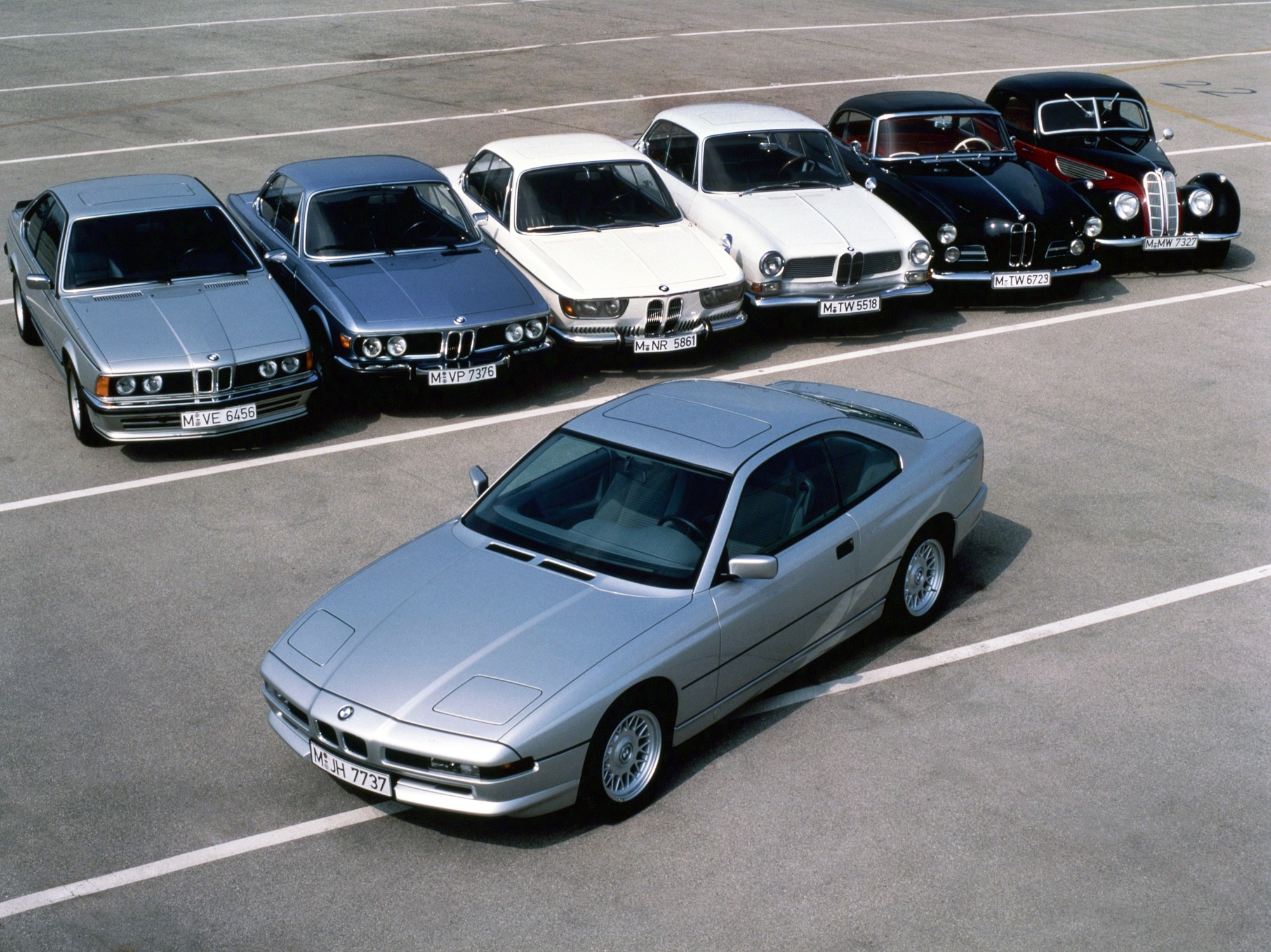 The E31 8 Series with a back drop of BMW Coupes over the years.