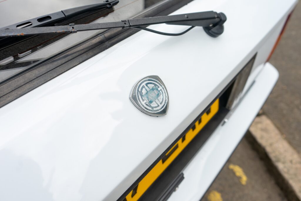 faded 1988 Lancia Delta HF Integrale badge