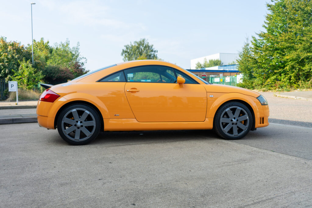 Side profile of Audi TT in Papaya Orange