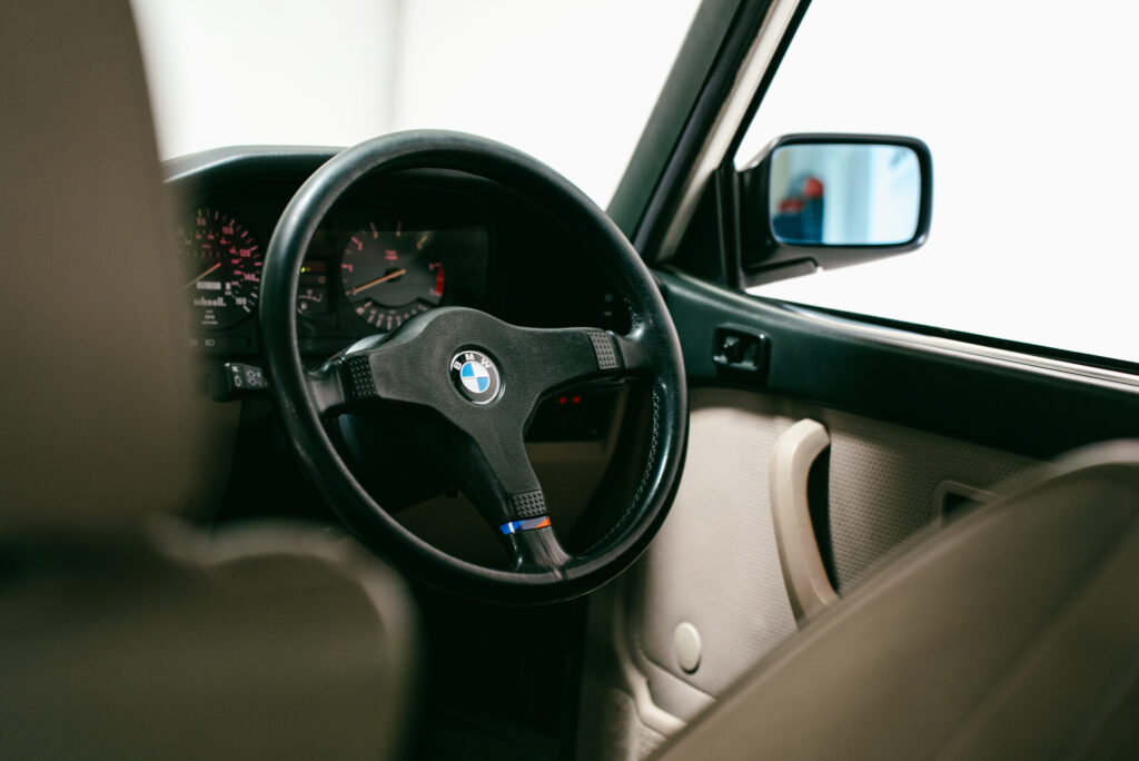 BMW M535i Driver's steering wheel. Right hand drive restored example with cream leather.