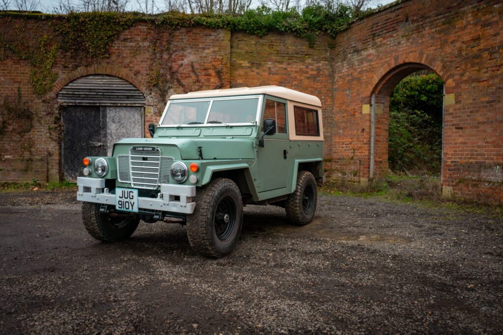 Three quarter profile of an old Land Rover Lightweight captured at a former military munitions base.